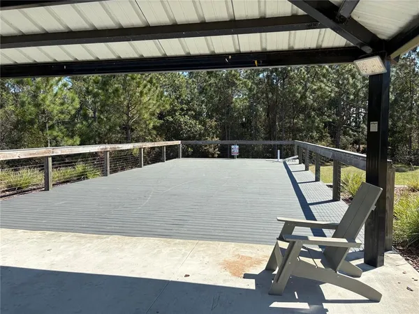 a view of a back yard from a balcony