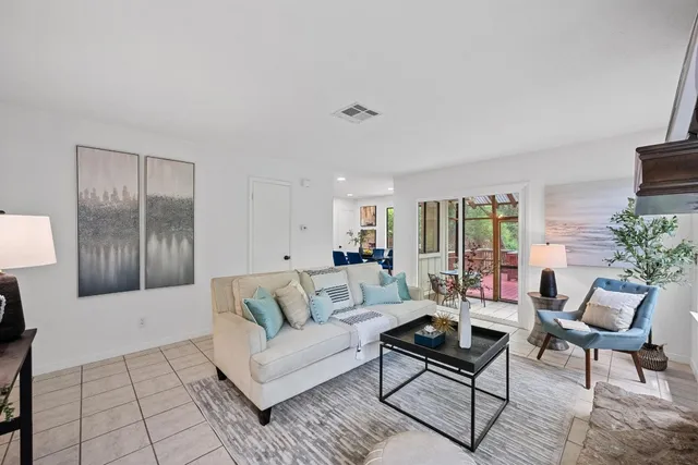 a living room with furniture and a couch