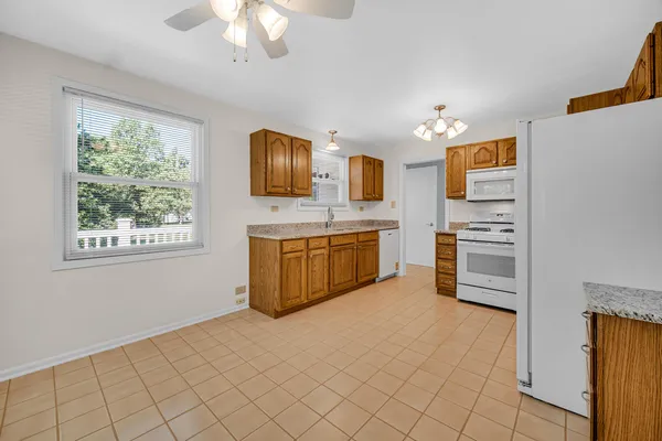 a kitchen with stainless steel appliances a stove sink and microwave