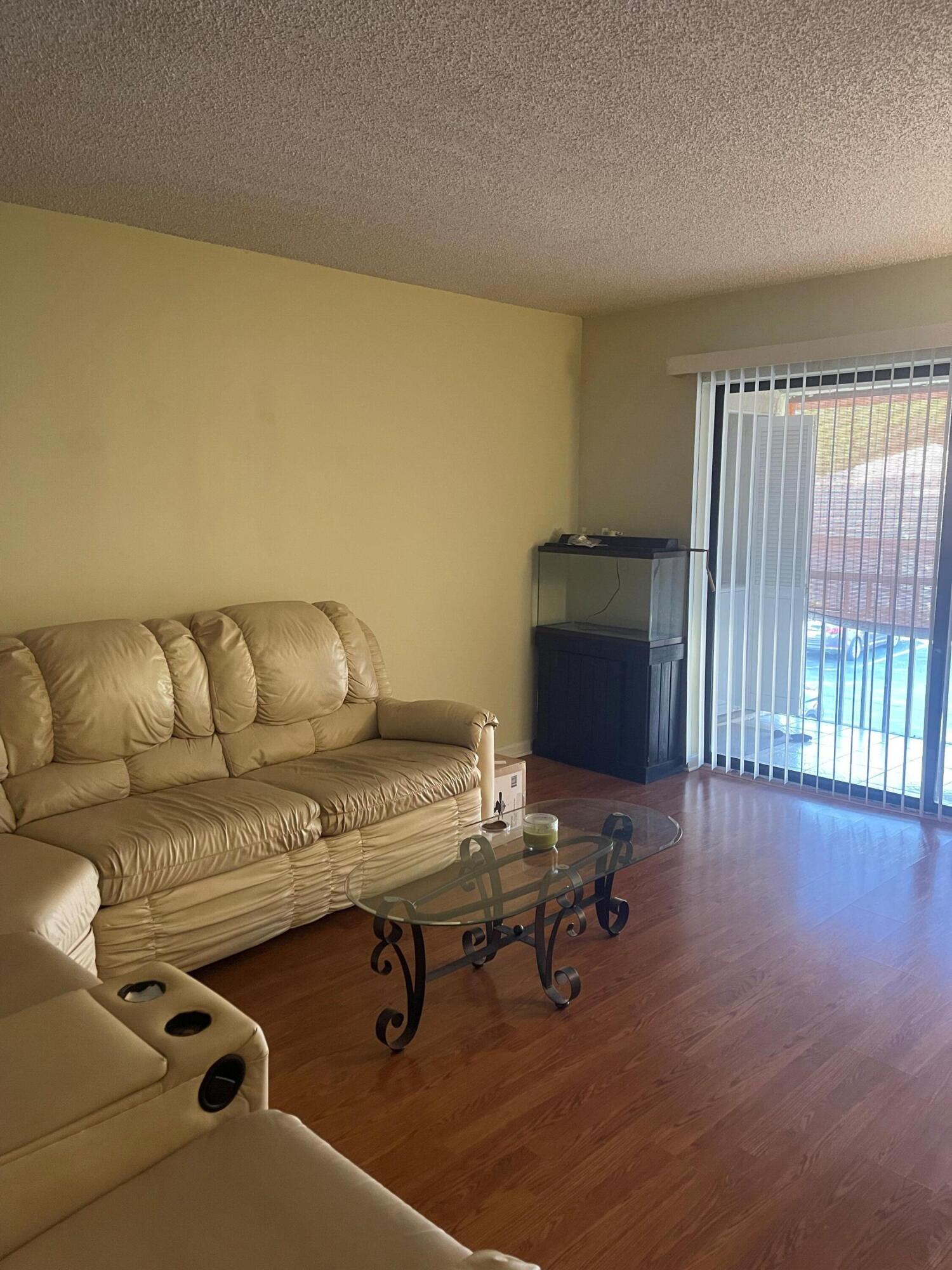 9900 Pineapple Tree Drive, Unit 206 Boynton Beach, FL 33436 - Photo 8 of 18 living room 2