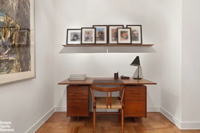 a view of a workspace with furniture