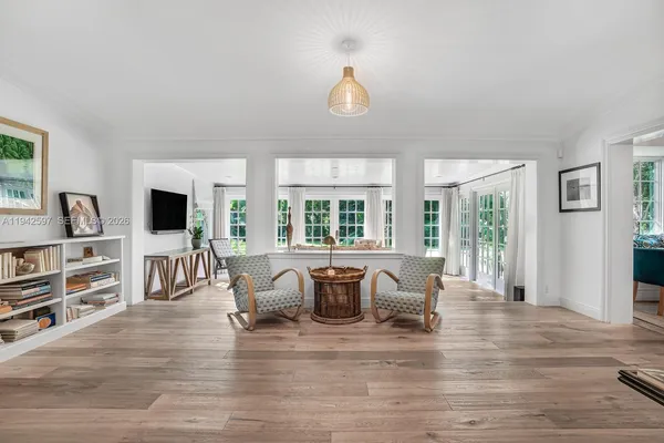 a view of a dining room with furniture window and wooden floor