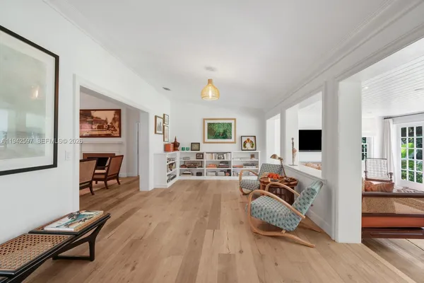 a living room with furniture flat screen tv and a fireplace