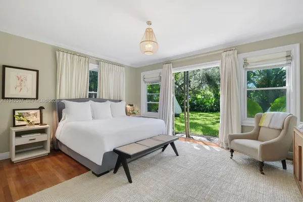 a spacious bedroom with a bed and a couch