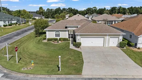 a aerial view of a house with a yard
