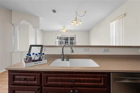 a kitchen with a sink and cabinets