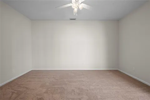 a view of a room with a fan