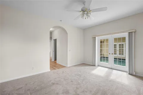 an empty room with windows and closet