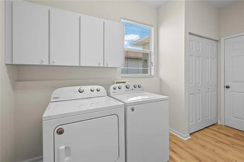 a view of storage and utility room with washer and dryer