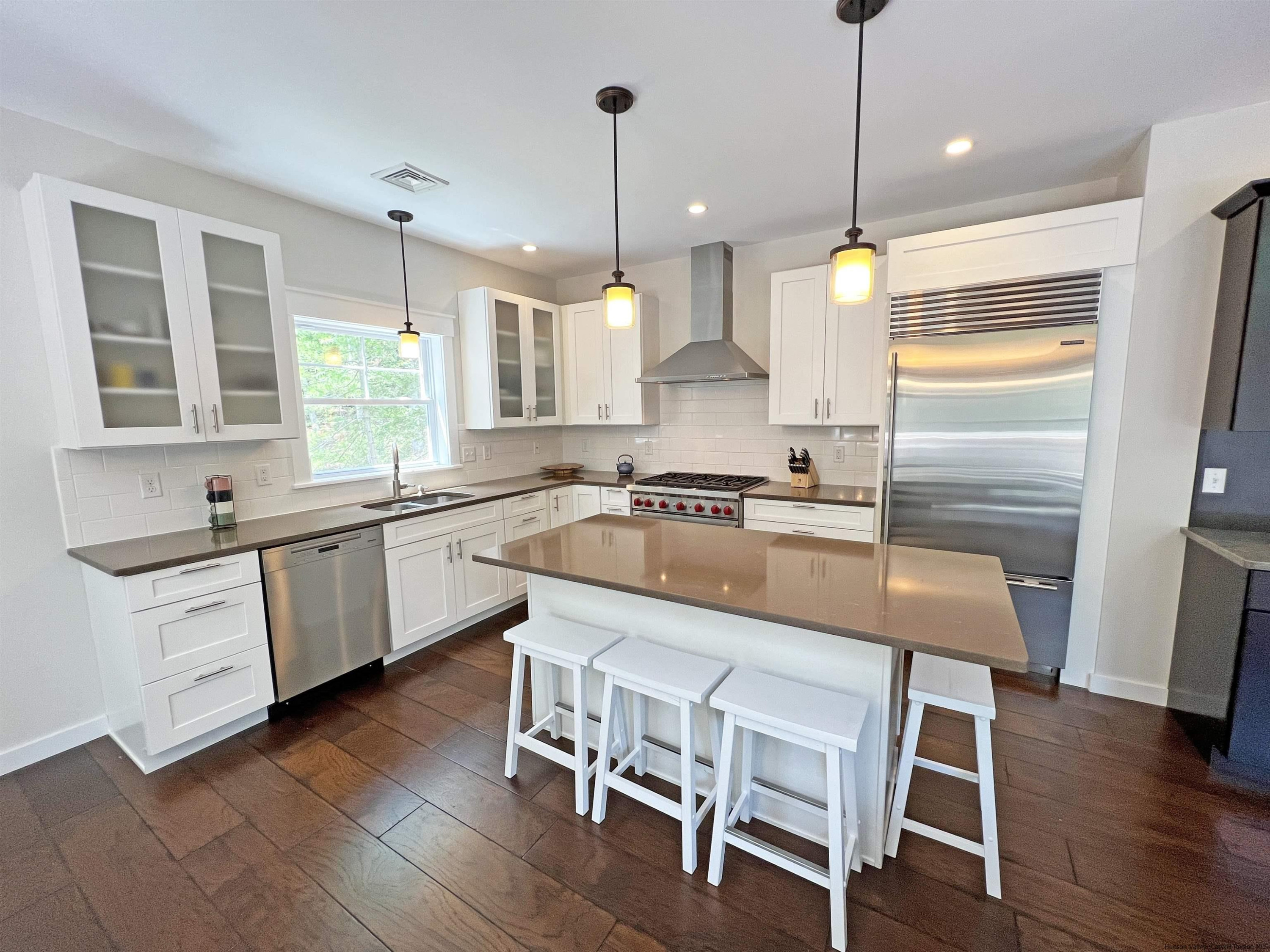 9 Magnolia Kingston, NY 12401 - Photo 12 of 33 a kitchen with a table chairs sink and cabinets