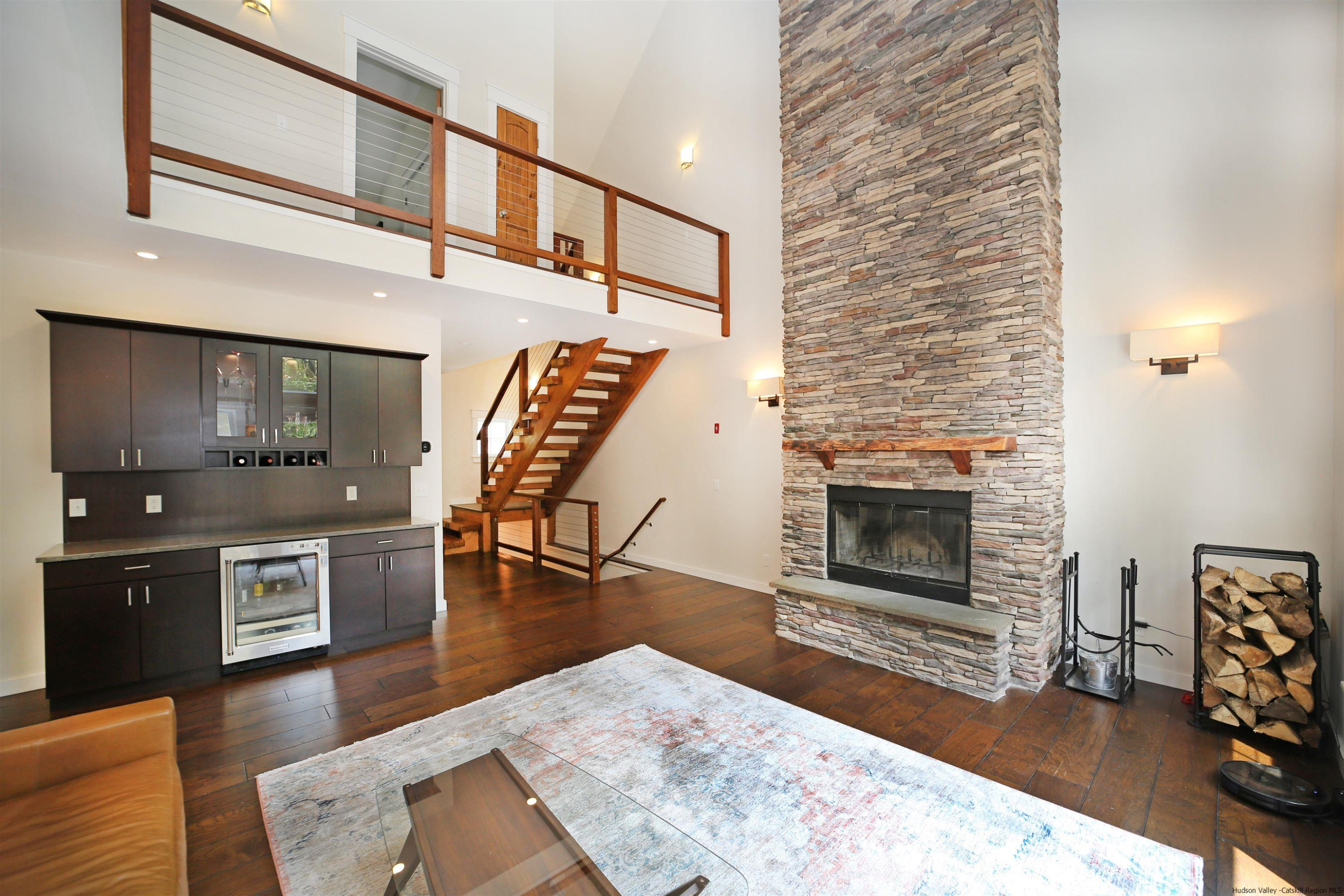 9 Magnolia Kingston, NY 12401 - Photo 13 of 33 a living room with furniture a fireplace and a flat screen tv