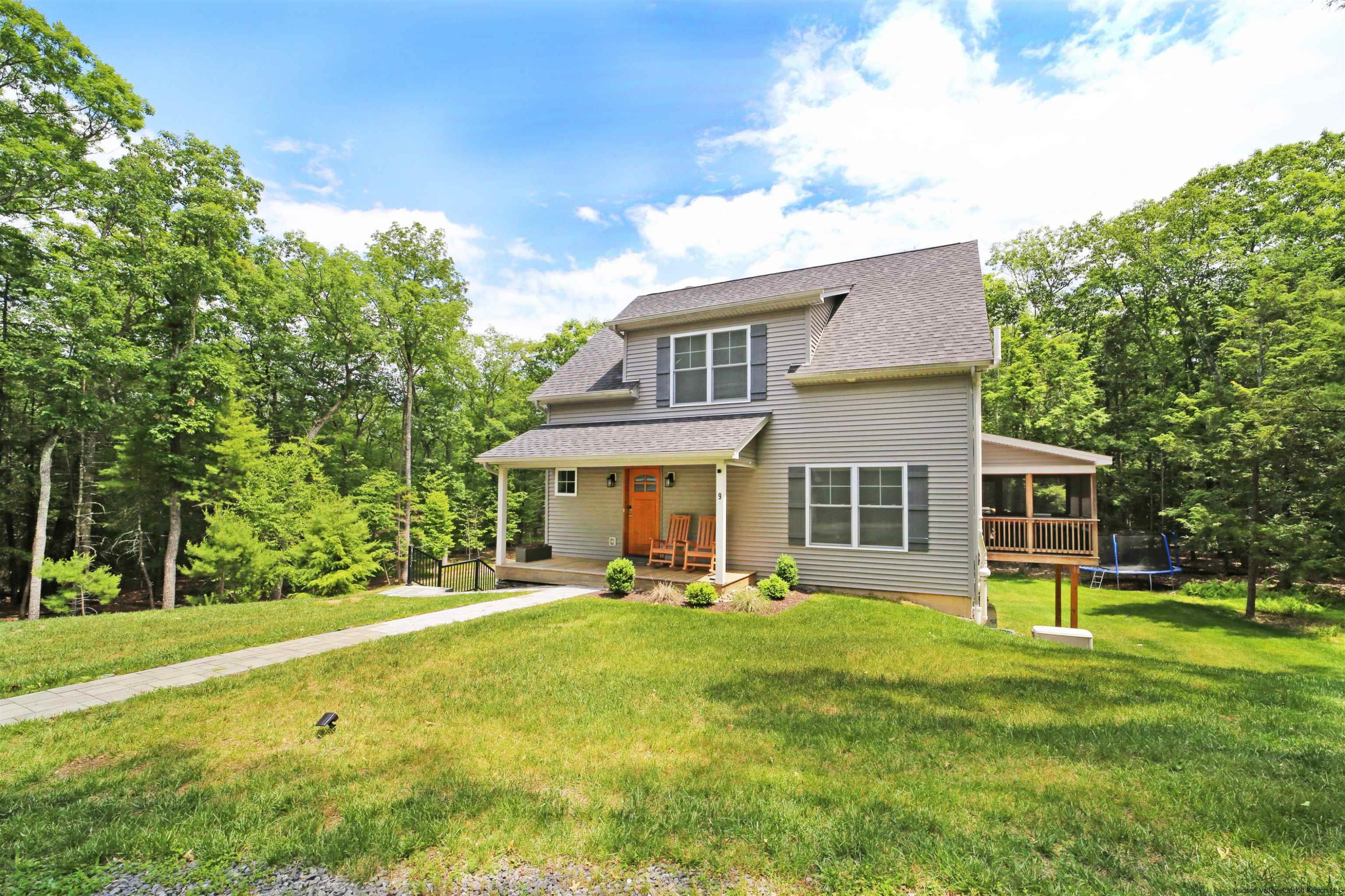 9 Magnolia Kingston, NY 12401 - Photo 2 of 33 a front view of house with yard and green space