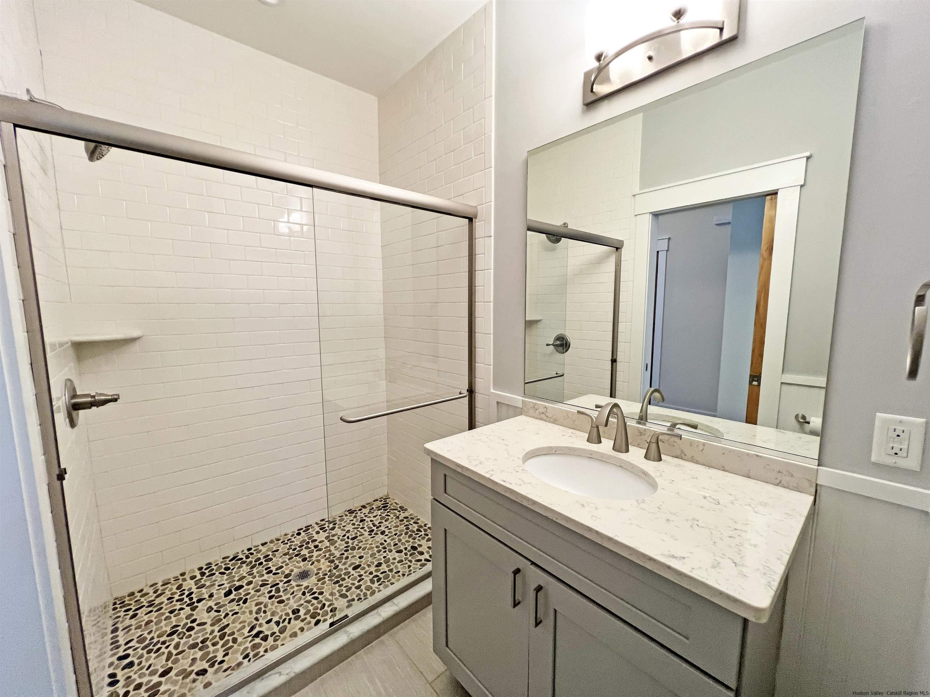 9 Magnolia Kingston, NY 12401 - Photo 25 of 33 a bathroom with a sink and a mirror