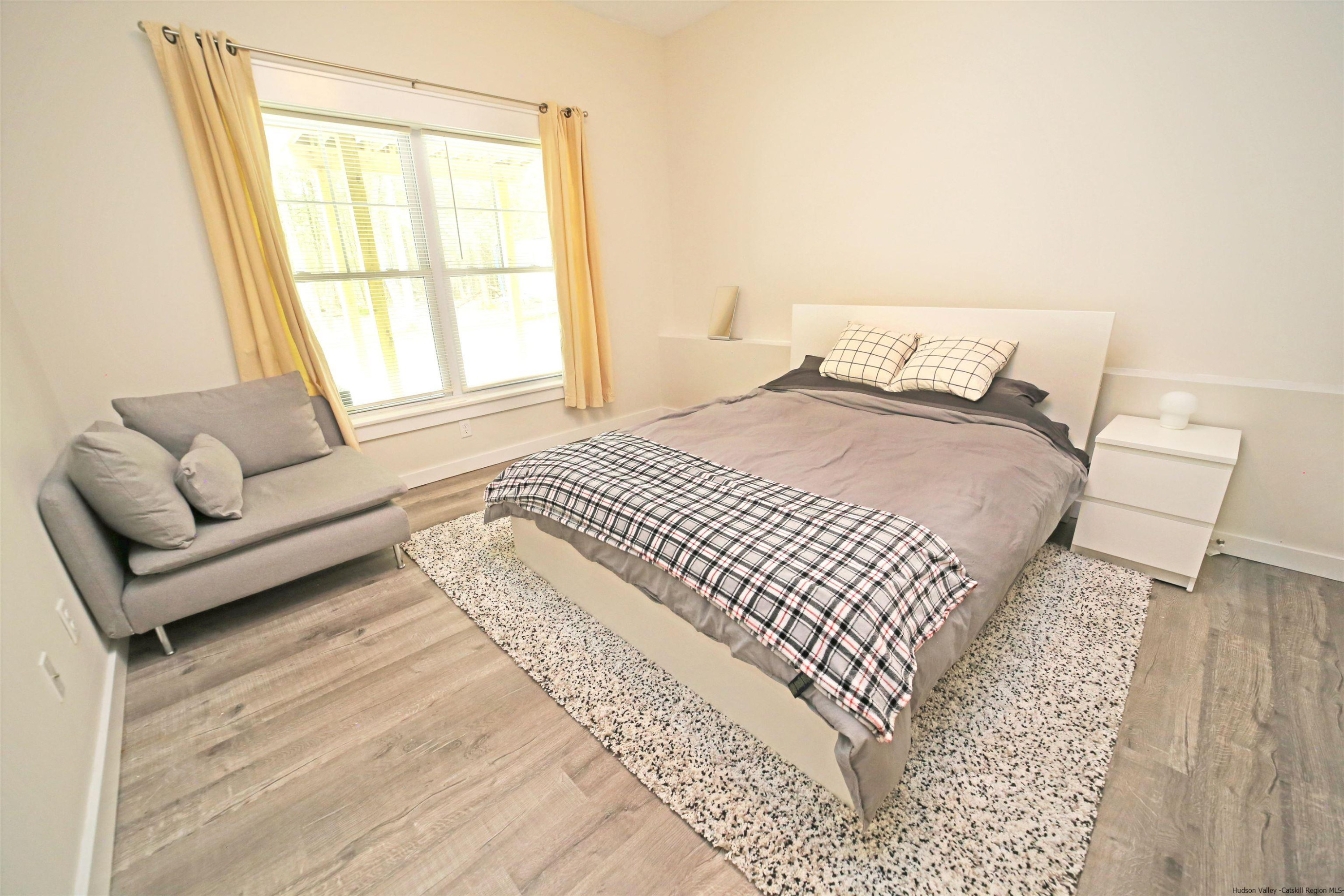 9 Magnolia Kingston, NY 12401 - Photo 26 of 33 a bedroom with a bed couch and a window