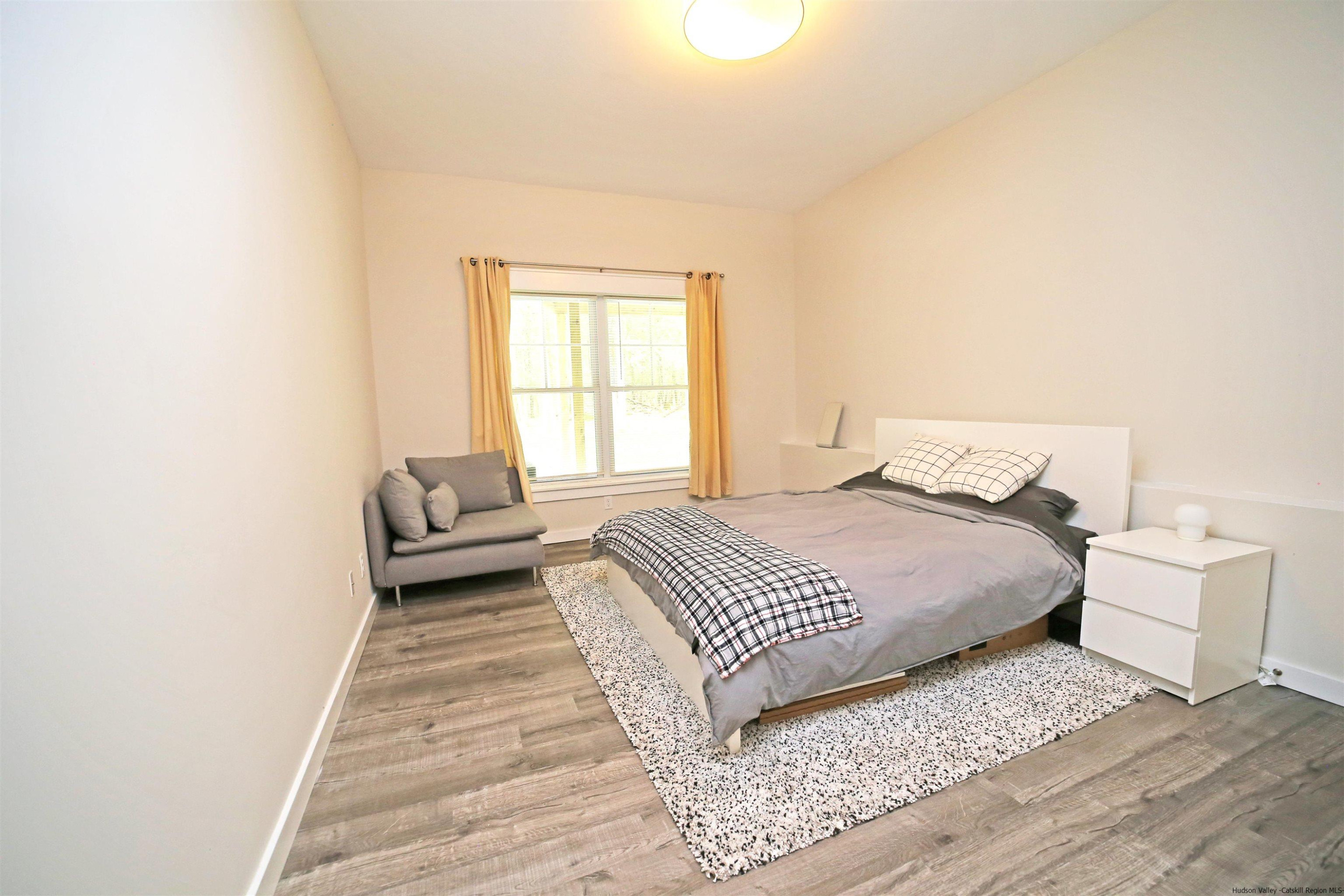 9 Magnolia Kingston, NY 12401 - Photo 27 of 33 a bedroom with a white bed and white walls
