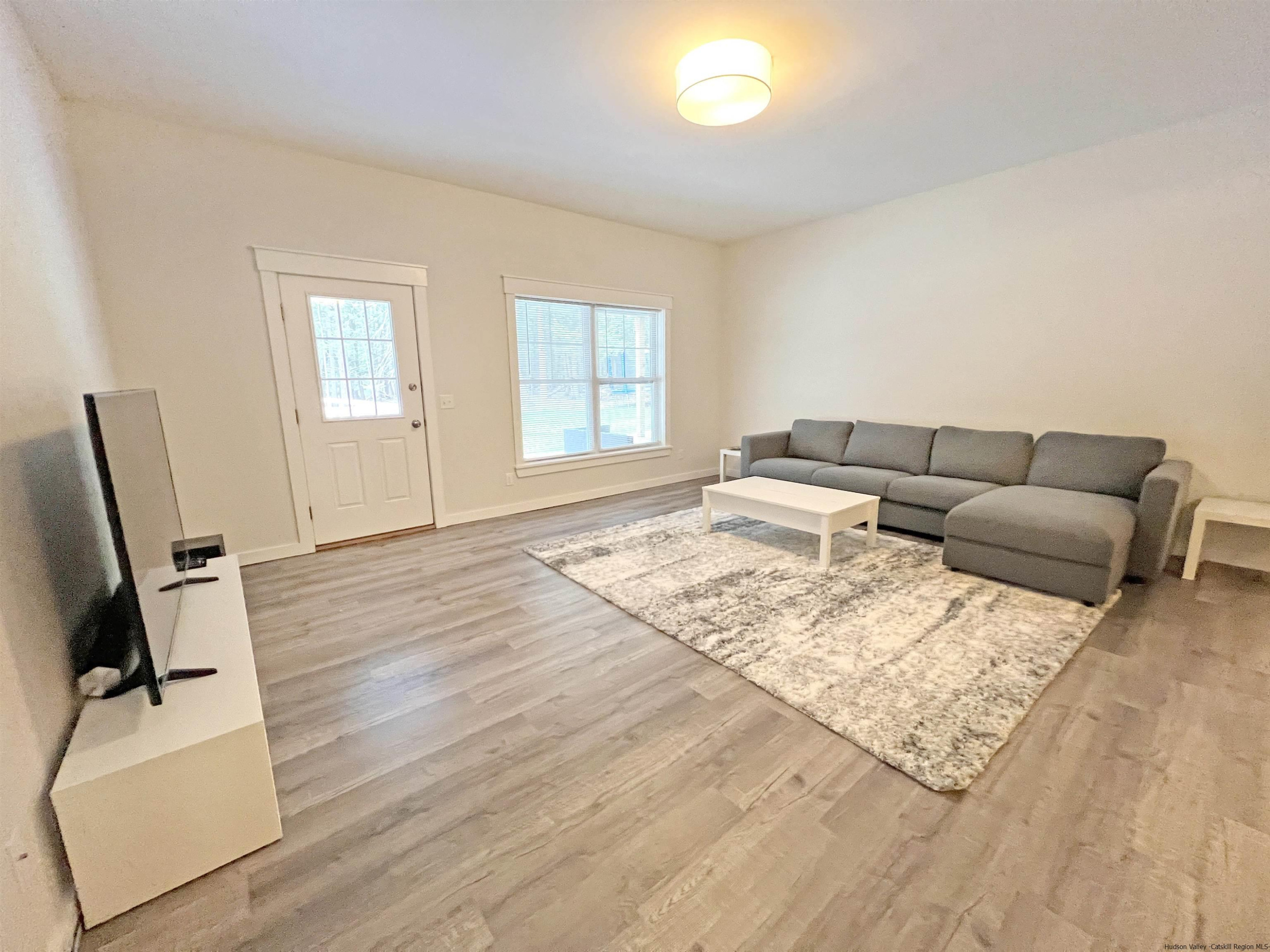 9 Magnolia Kingston, NY 12401 - Photo 28 of 33 a living room with furniture and a flat screen tv