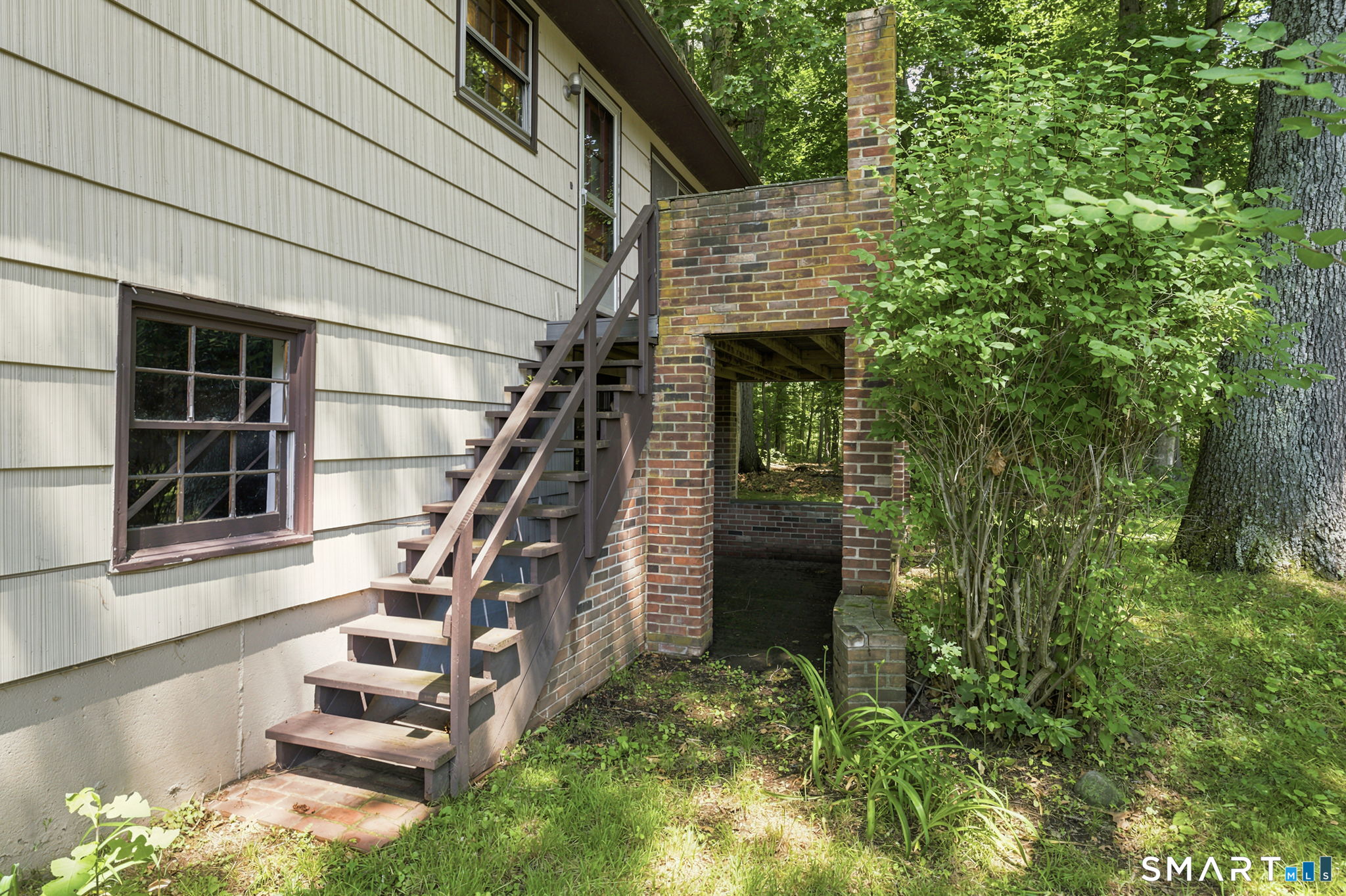 448 Mixville Road Cheshire, CT 06410 - Photo 30 of 32 a house with trees in front of it