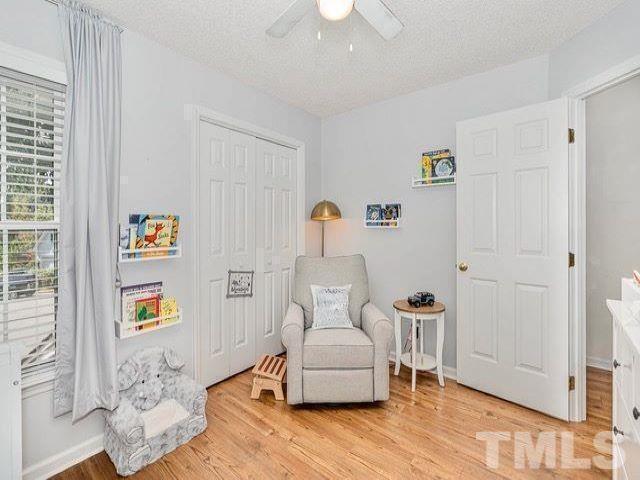 8824 Whitby Court Raleigh, NC 27615 - Photo 16 of 25 a living room with furniture and a window