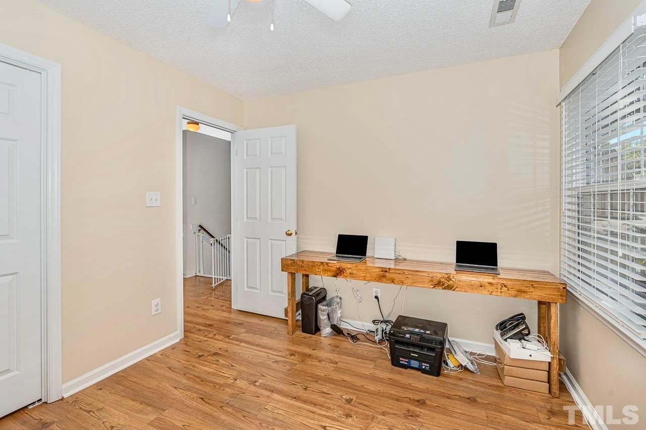 8824 Whitby Court Raleigh, NC 27615 - Photo 19 of 25 a view of a kitchen with a workspace