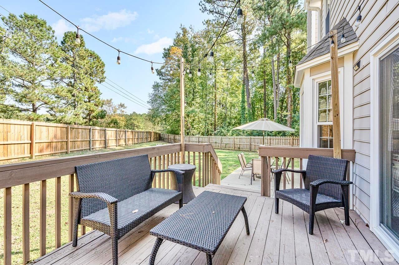 8824 Whitby Court Raleigh, NC 27615 - Photo 20 of 25 a view of a chairs and table on the deck