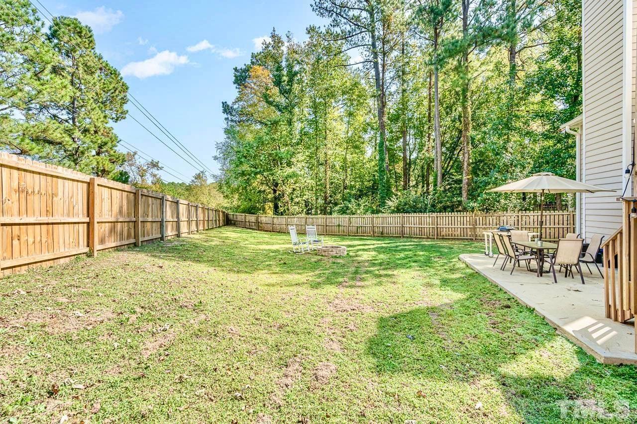 8824 Whitby Court Raleigh, NC 27615 - Photo 22 of 25 a view of a garden with a slide