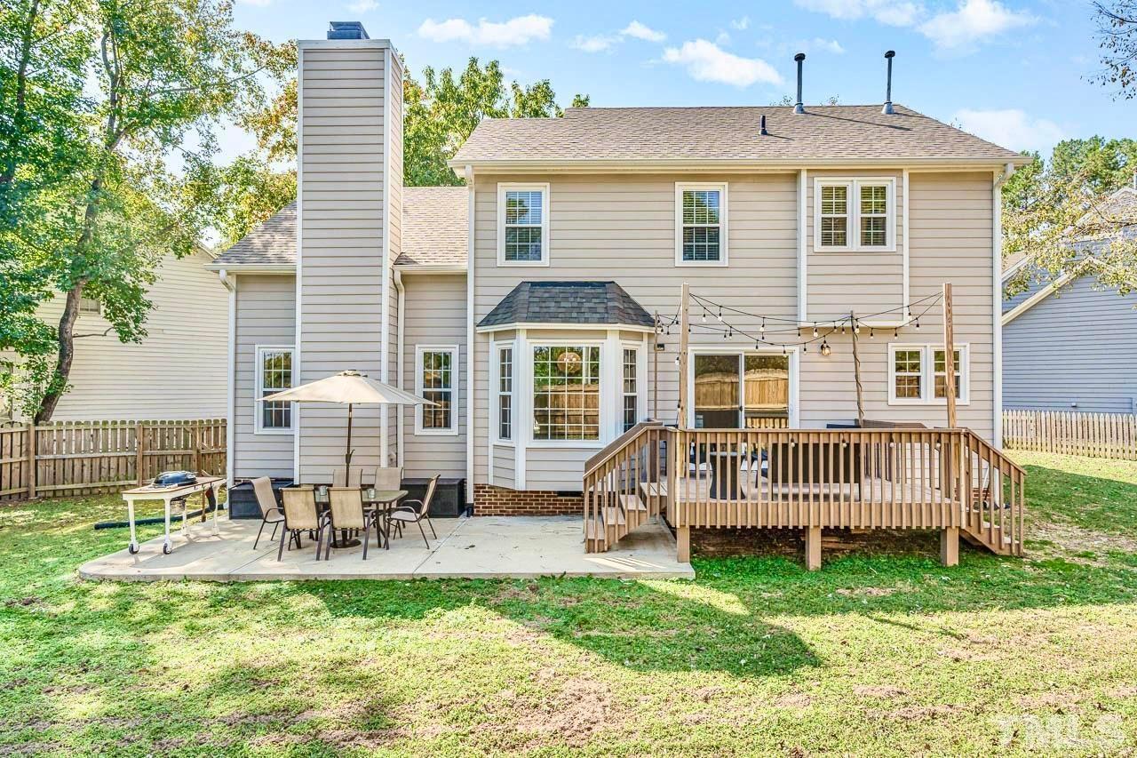 8824 Whitby Court Raleigh, NC 27615 - Photo 23 of 25 a front view of a house with a yard
