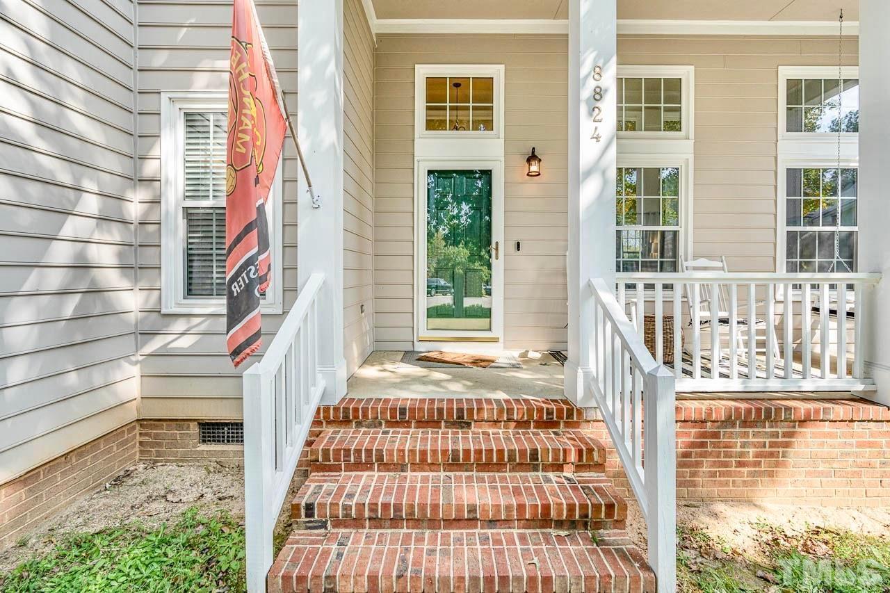 8824 Whitby Court Raleigh, NC 27615 - Photo 4 of 25 a front view of a house with a yard