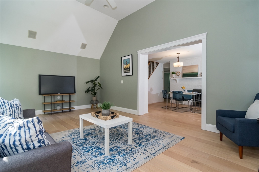 58 Beaver Dam Road Natick, MA 01760 - Photo 13 of 24 a living room with furniture and a flat screen tv