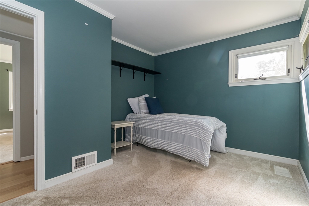 58 Beaver Dam Road Natick, MA 01760 - Photo 15 of 24 a bedroom with a bed and window
