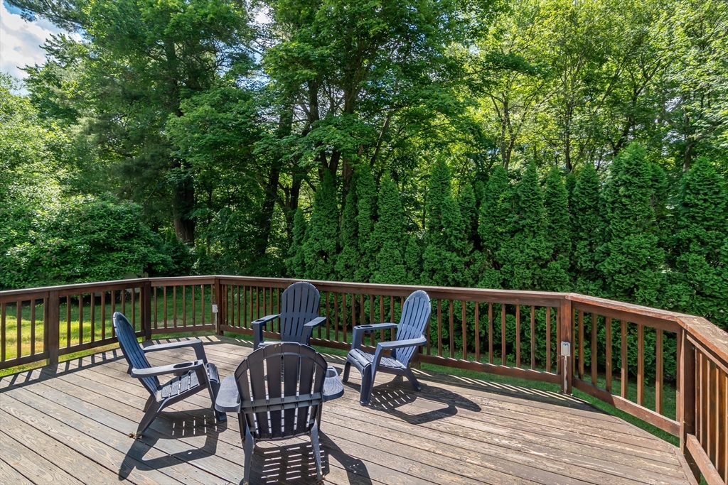 58 Beaver Dam Road Natick, MA 01760 - Photo 22 of 24 a view of balcony with furniture and trees around