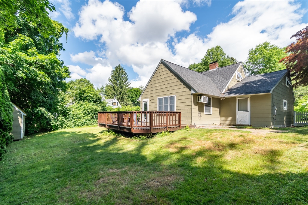 58 Beaver Dam Road Natick, MA 01760 - Photo 24 of 24 a view of a house with a yard potted plants and large tree