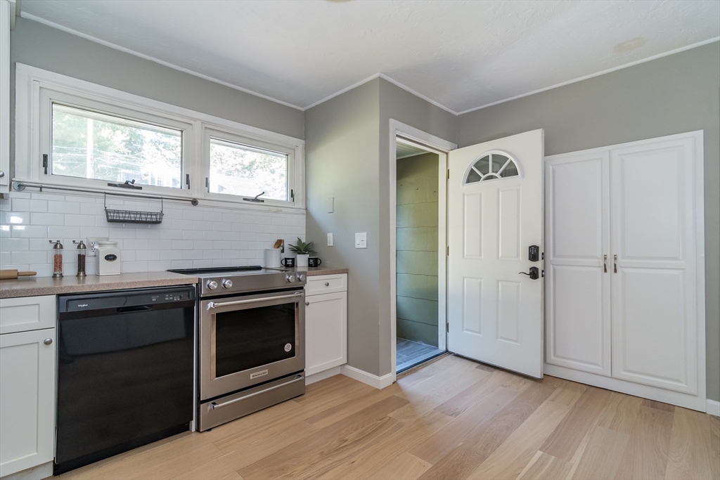 58 Beaver Dam Road Natick, MA 01760 - Photo 3 of 24 a kitchen with granite countertop a stove and a sink