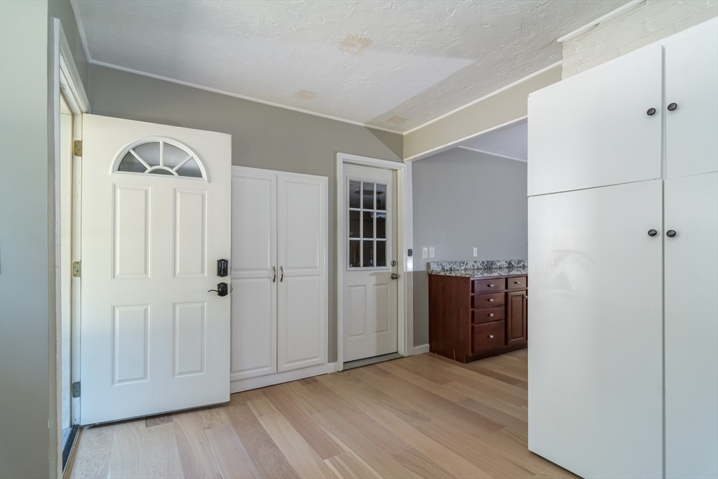 58 Beaver Dam Road Natick, MA 01760 - Photo 6 of 24 an empty room with wooden floor and closet