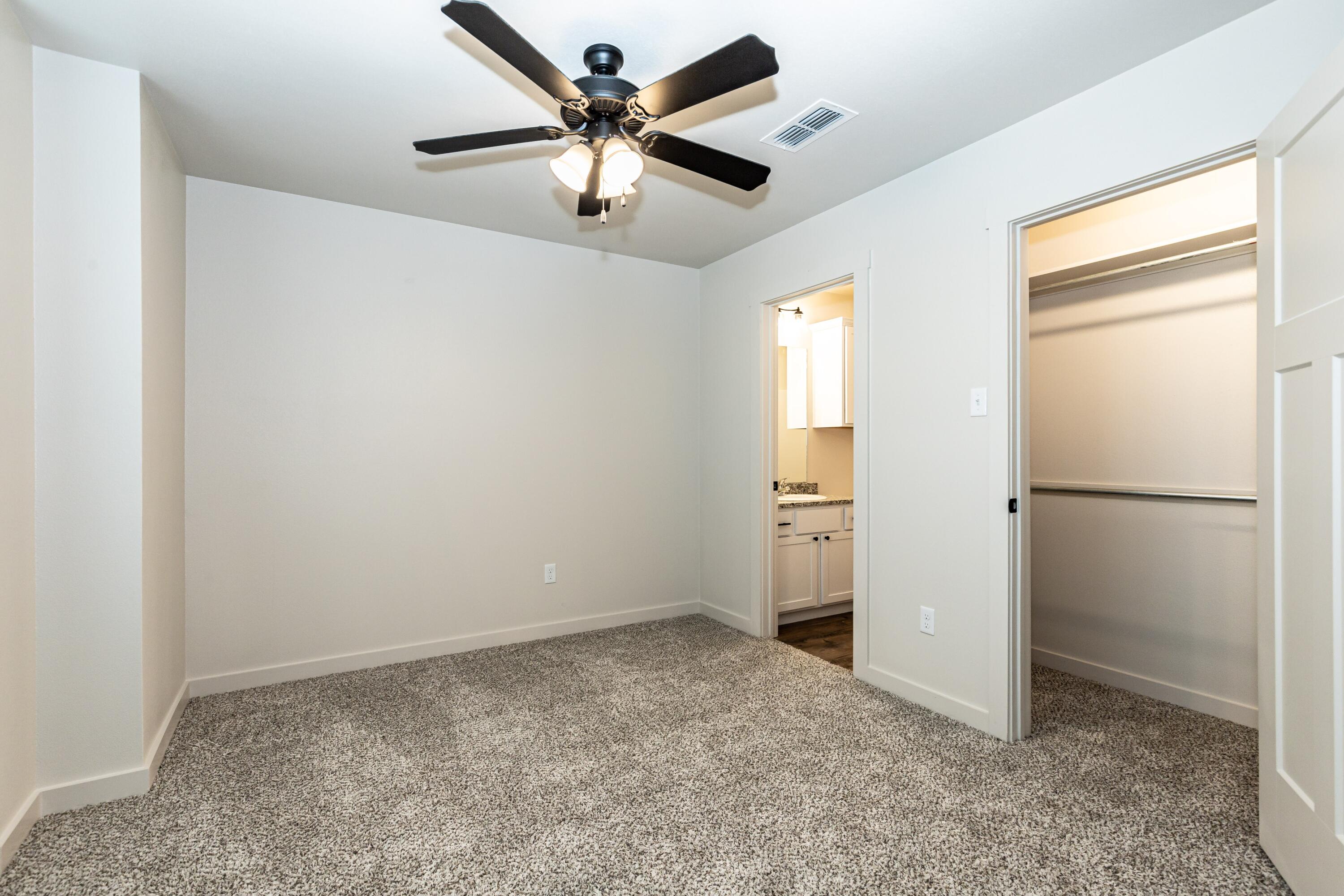2529 138th Street Lubbock, TX 79423 - Photo 15 of 24 an empty room with a empty space and a ceiling fan