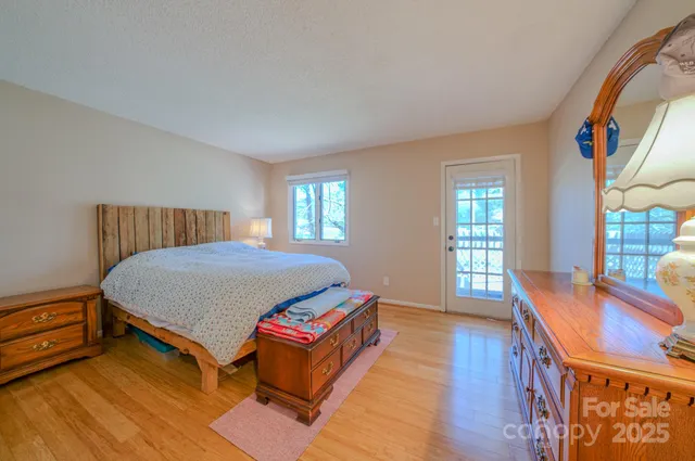 a bed room with a bed and a window