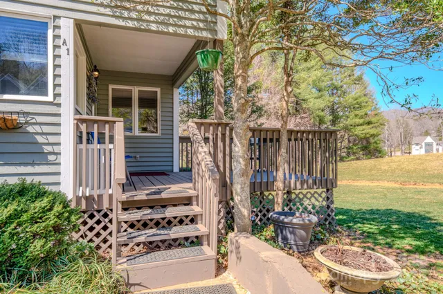 a view of a patio with couches table and chairs and potted plants