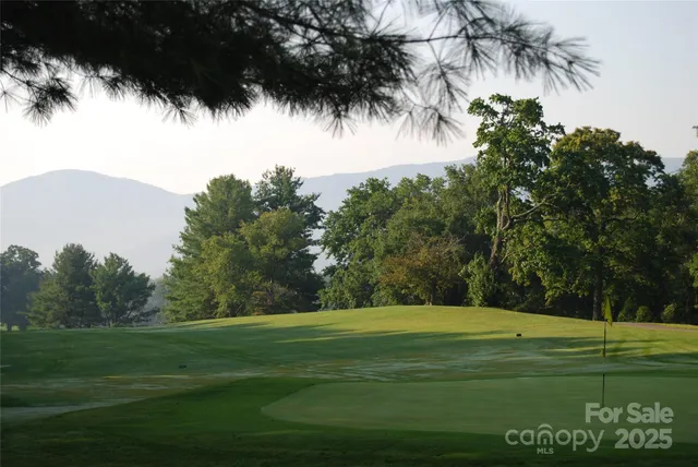 a view of a lake with a big yard
