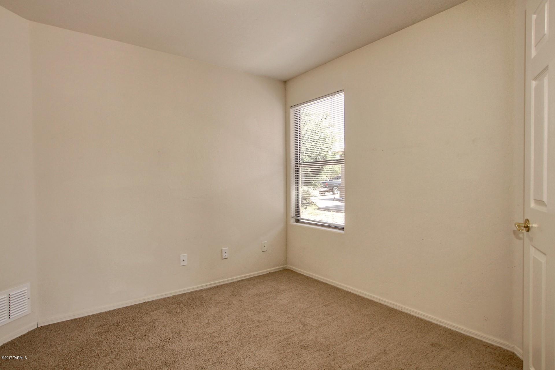 8350 East Bowline Road Tucson, AZ 85710 - Photo 16 of 26 an empty room with windows