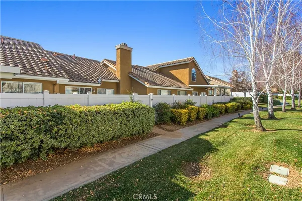 front view of a house with a small yard
