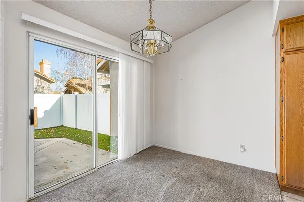 a view of an entryway with chandelier