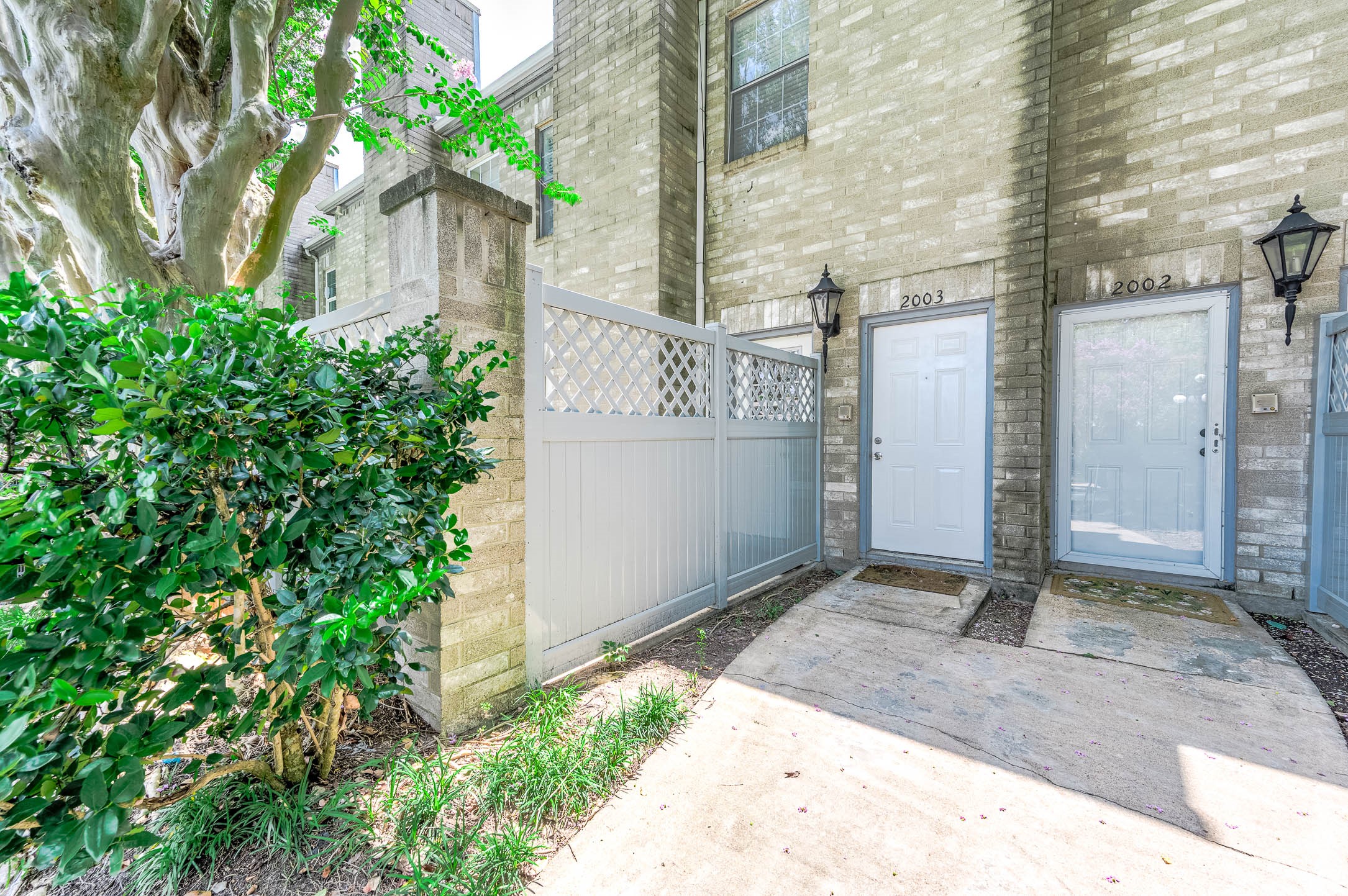6000 Reims Road, Unit 2003 Houston, TX 77036 - Photo 3 of 24 a backyard of a house with lots of green space