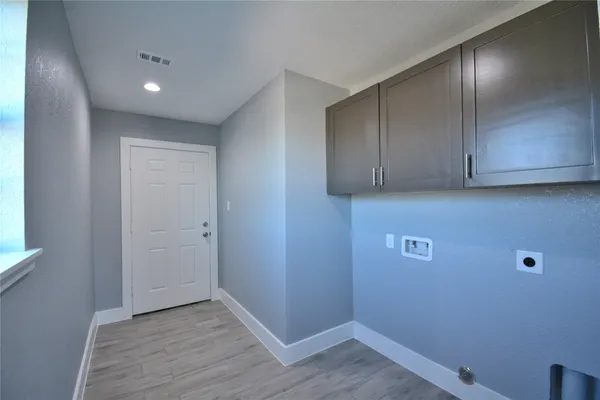 a view of hallway with wooden floor