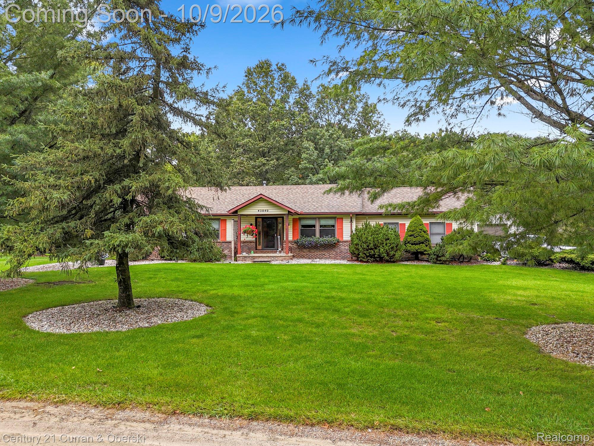 43040 Willis Road Belleville, MI 48111 - Photo 59 of 65 Ranch-style residence featuring a prominent front lawn, mature trees, and a covered porch entry