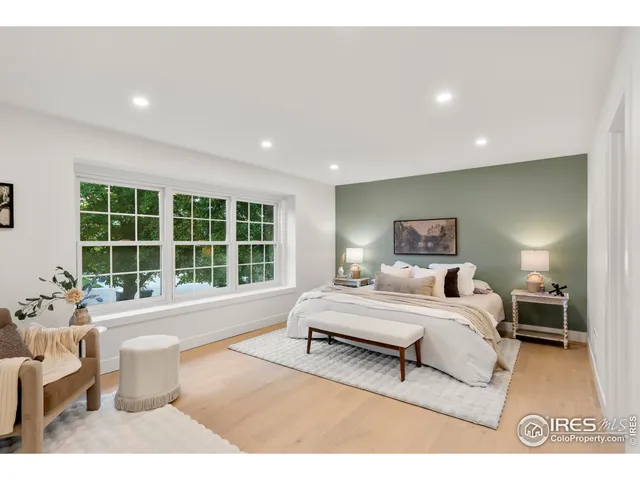 a spacious bathroom with a double vanity sink and a bathtub