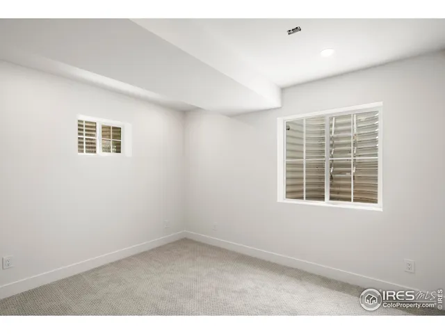 a bathroom with a sink a mirror a vanity and shower