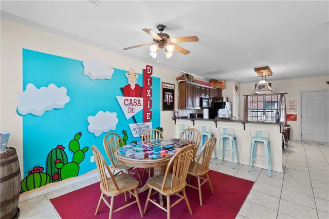 a view of a dining room with furniture and chandelier