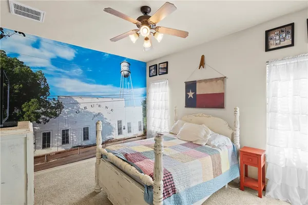 a bathroom with a granite countertop sink toilet a mirror and shower