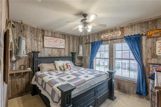 a bathroom with a granite countertop sink a toilet and a mirror