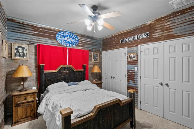 a kitchen with a sink a refrigerator and chairs