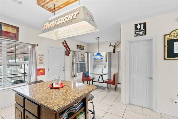 a bedroom with furniture and a window